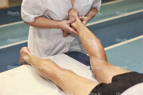 stock-photo-39720180-masseuse-massaging-athlete-s-achilles-tendon-after-running - Pickering ...