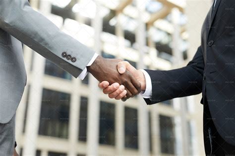 Businessmen Shaking Hands - Stock Photos | Motion Array