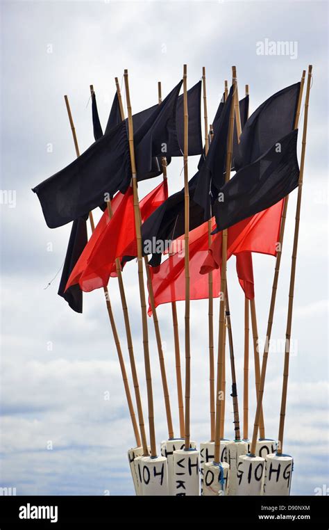 Flags flying in wind Stock Photo - Alamy