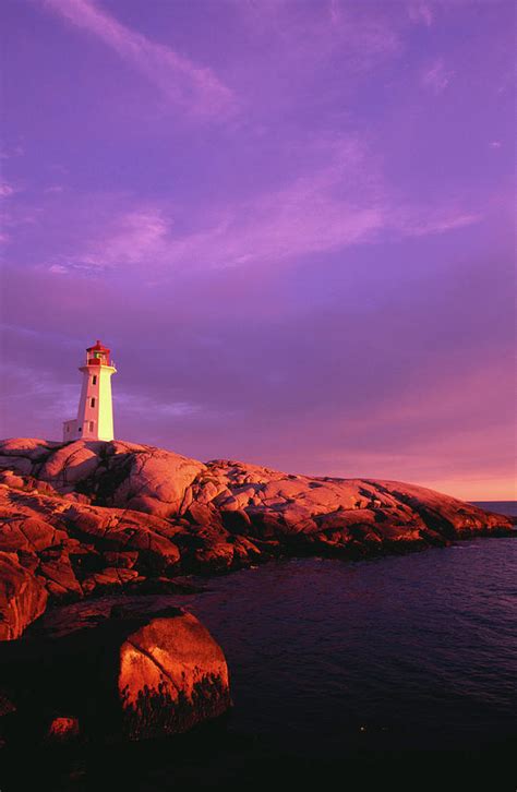 Peggys Cove Lighthouse At Sunset Photograph by Greg Johnston