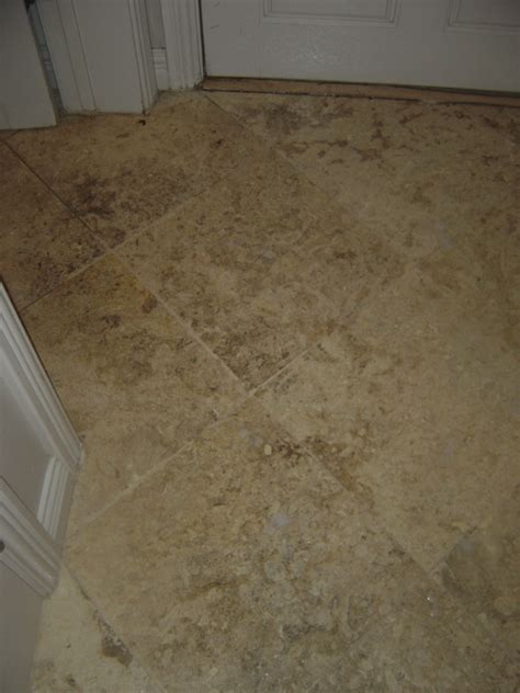 Travertine floor BEFORE cleaning and sealing Tucson - AZ Tile & Grout Care Inc.