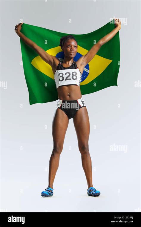 Female Athlete Holding a Brazilian Flag Stock Photo - Alamy