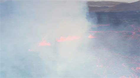 Volcano vent eruption with ejected lava river flowing 4K Stock Footage Video | World Footage