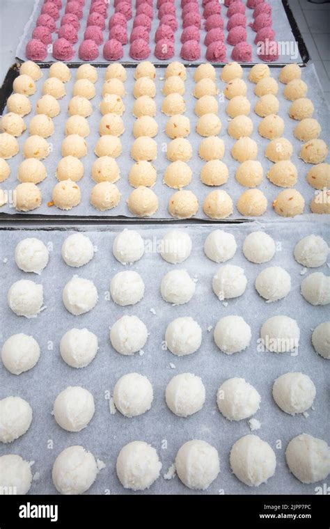 Cakes on automatic conveyor belt or line, baking process in confectionery factory. Food industry ...