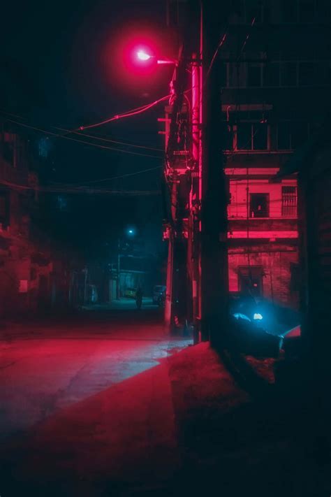 Download Neon Red Aesthetic Light Illuminating A Street Wallpaper ...