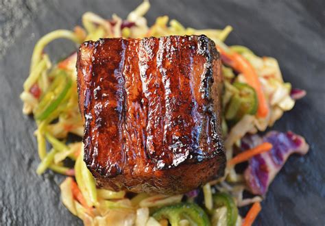 Slow Roasted Pork Belly Bites over Jalapeno Slaw