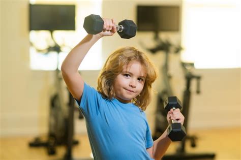 Premium Photo | Child workout kid in gym kid sport child exercising ...