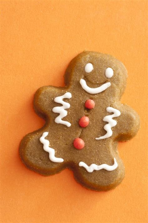 Gingerbread cookie on a festive orange background - Free Stock Image