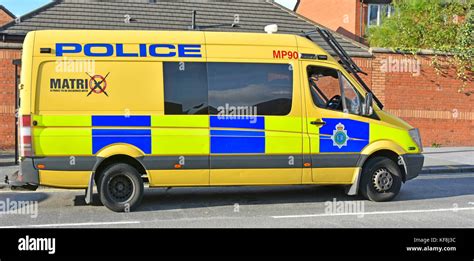 Merseyside police public order Matrix disruption team patrolling in Liverpool in yellow Mercedes ...