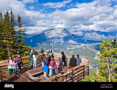 Visitors on a Viewing platform on Sulphur Mountain summit overlooking Stock Photo: 61484393 - Alamy