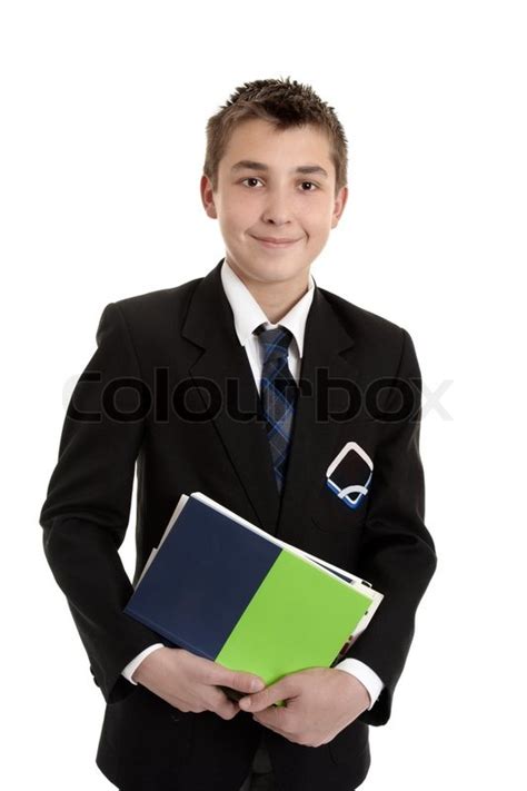 A secondary school student wearing his school uniform holding a bunch of text books | Stock ...