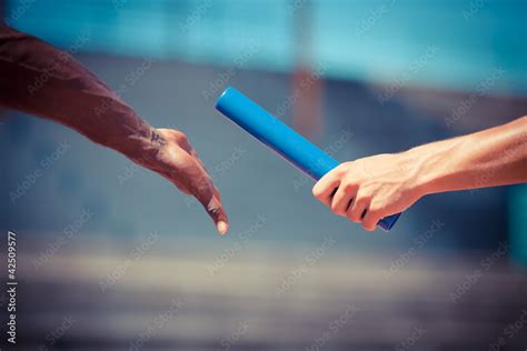 Passing the Relay Baton Stock Photo | Adobe Stock