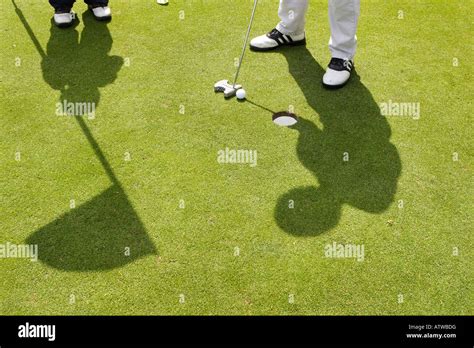 golf green putting flag shadow Stock Photo - Alamy