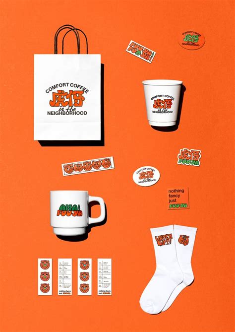 coffee cups and stickers are on an orange surface