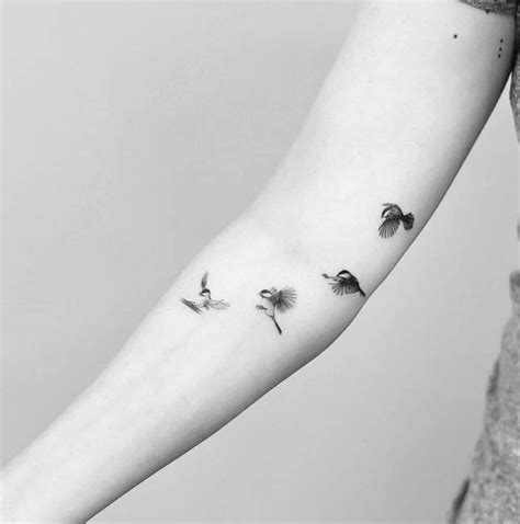 Flying black-capped chickadee sequence tattoo on the