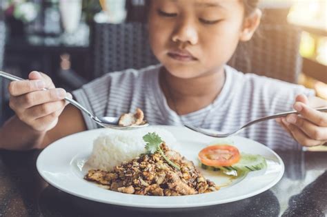 Premium Photo | Thai children eating in restaurant