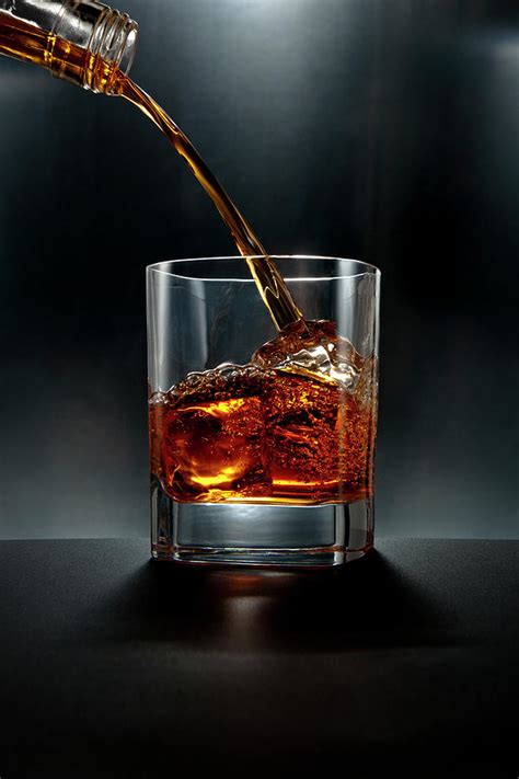 Brown Liquor Drink Pour On Black by Chris Stein