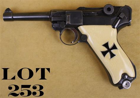 German Luger semi-auto pistol, nazi proofed, 9mm cal., 4” barrel, military black finish, ivory gri
