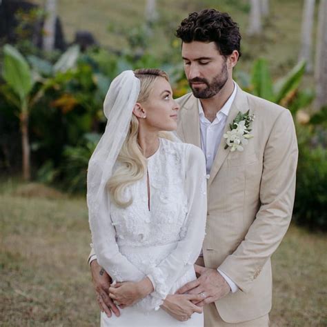 the bride and groom are standing close together in front of some palm ...