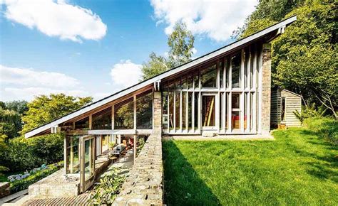 Sloping roof on 1960s renovation in Wiltshire | Sloping lot house plan, Architecture ...