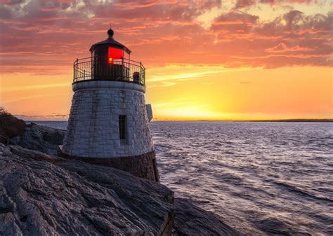 Castle,Hill,Lighthouse,In,Orange,Sunset