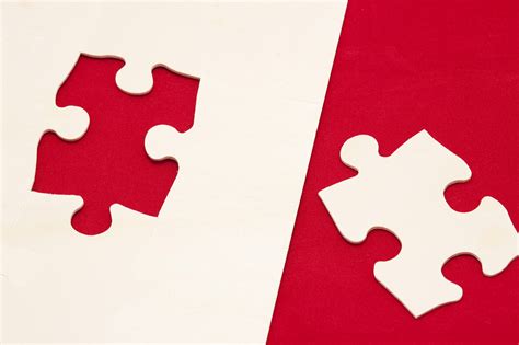 Free Image of Conceptual Red and White Jigsaw Puzzle Game | Freebie.Photography