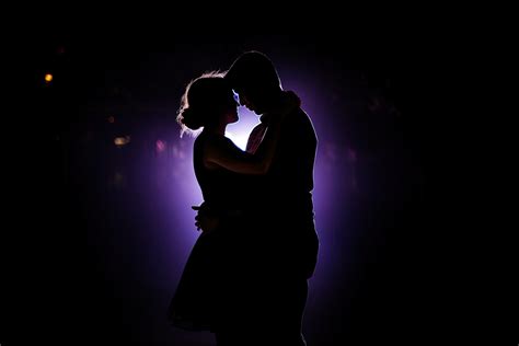 Silhouette of a romantic couple dancing and enjoying in the dark. 23978102 Stock Photo at Vecteezy