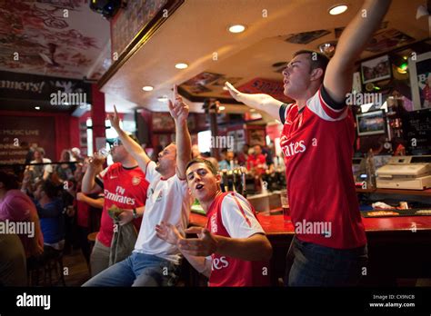 Arsenal football fans watching the game on television inside The Stock ...