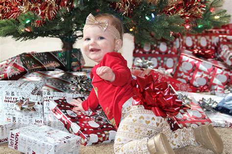 Happy Baby Under Christmas Tree Free Stock Photo - Public Domain Pictures