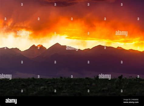 Purple Mountains During Fiery Sunset Stock Photo - Alamy