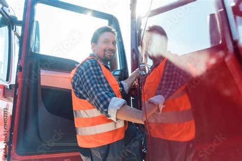 Stock Image: Truck driver in front of his long haul lorry getting in Truck Driver, Drivers ...