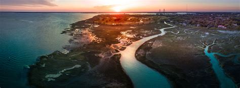 I took an aerial panorama at Shem Creek at sunset : r/Charleston