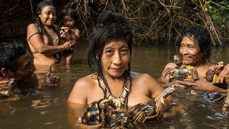 Photographing Indigenous Communities Under Threat in the Amazon | Women bathing, Amazon people ...