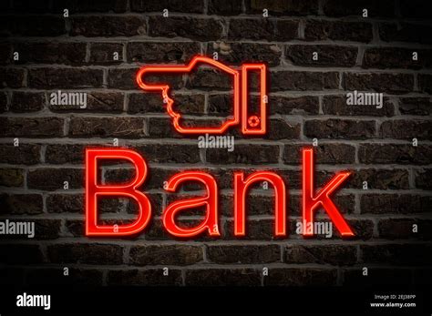 Detail photo of a neon sign on a wall with the inscription Bank Stock Photo - Alamy