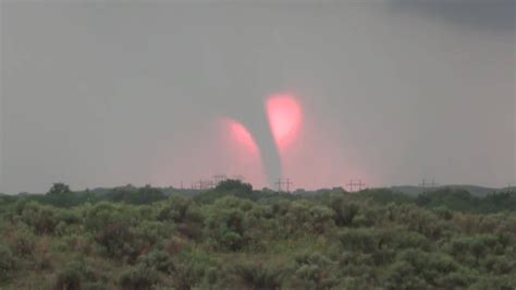 Sunset and a tornado captured near Woodward, Oklahoma May 24, 2016. X ...