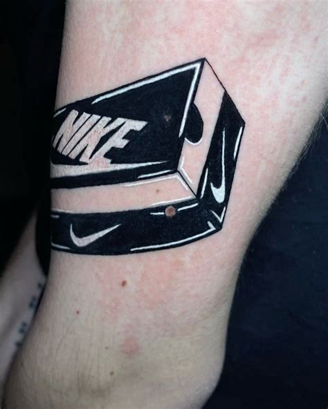 Nike Swoosh Eyebrow Tattoos