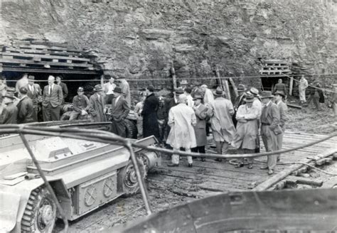 Old photo showing several people in front of a mine in Letcher County ...