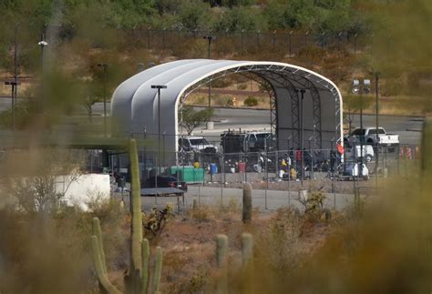 Border Patrol hold migrants outdoors at Ajo station