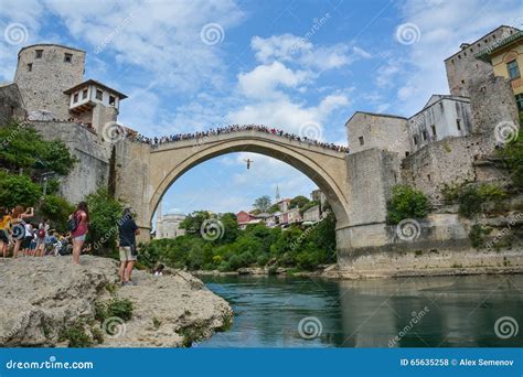 Man Jumping from a Very High Ancient Bridge in Mostar Editorial Stock Photo - Image of arch ...