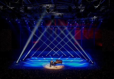 maraya concert hall appears as a giant mirrored mirage in the desert