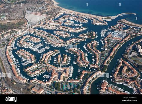 AERIAL VIEW. The seaside town of Port Grimaud, created in the 60s on a marshy land. Gulf of ...