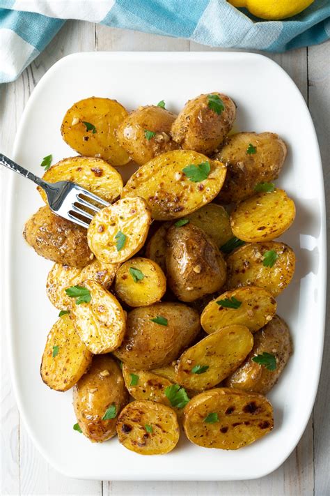 Roasted Greek Lemon Potatoes Recipe (VIDEO) - A Spicy Perspective