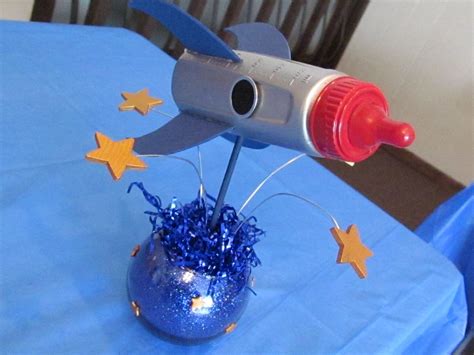 Outer Space themed baby shower center piece made from a baby bottle. SOOO CUTE! Have to! | Space ...