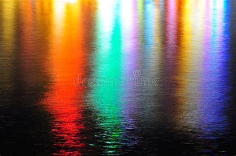 Beautiful Water Reflection. Reflection of colours and spot lights in ...