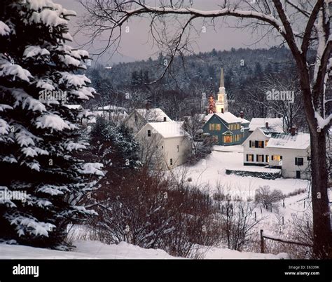 SNOW COVERED NEW ENGLAND WINTER EVENING SCENE WITH LIGHTS ON A Stock Photo, Royalty Free Image ...