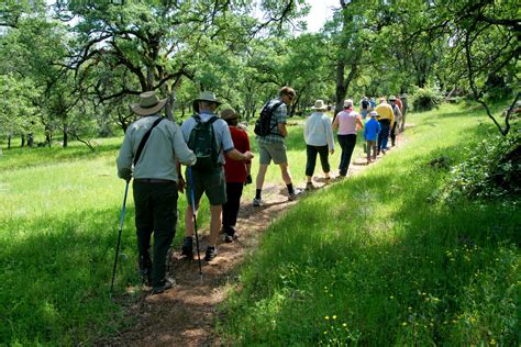 Placer Land Trust | People Hiking Sticks Green