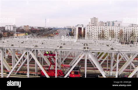 Railroad bridge. Train for construction. Workers lay new rails up view Stock Video Footage - Alamy