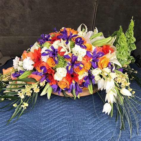 Casket Spray in Orange/Purple - Our Flower Gallery