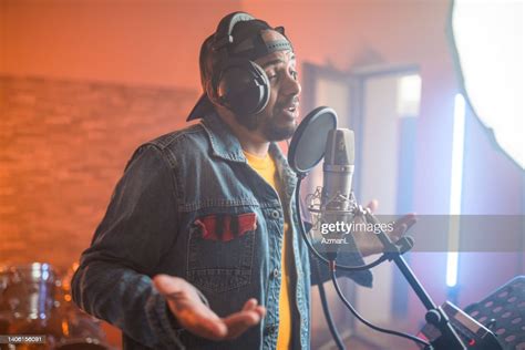 Young Hip Hop Singer Recording Music In Recording Studio High-Res Stock ...