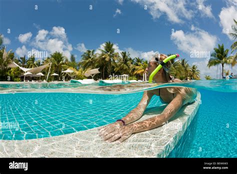 Woman in Swimming Pool, South Male Atoll, Maldives Stock Photo - Alamy